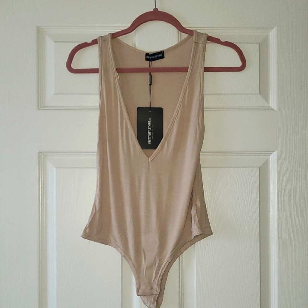 Basic Nude Jersey Plunge Neck Thong Bodysuit by Prerty Little Things. NWT